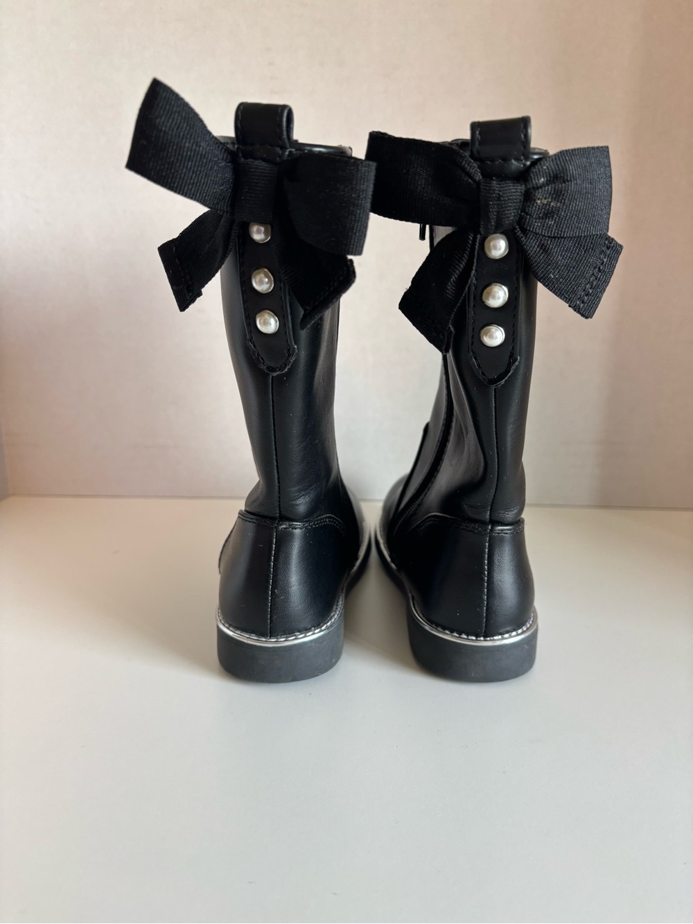 Girls black riding boots with cute bow and pearl design
